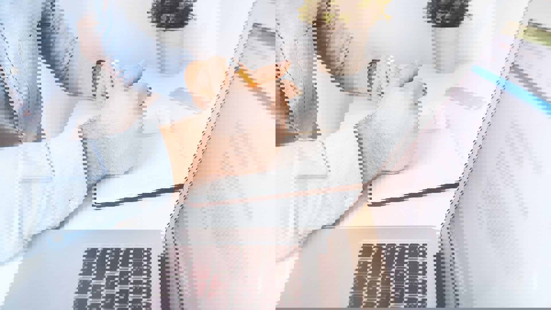 Person sitting down doing their tax at the computer