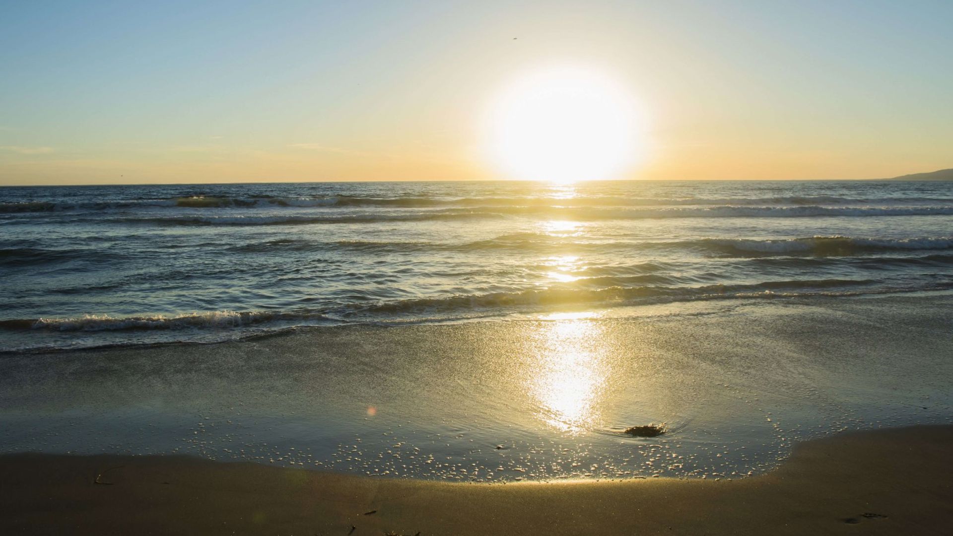 Baby yawning in his parents arms after being born using their GMHBA cover