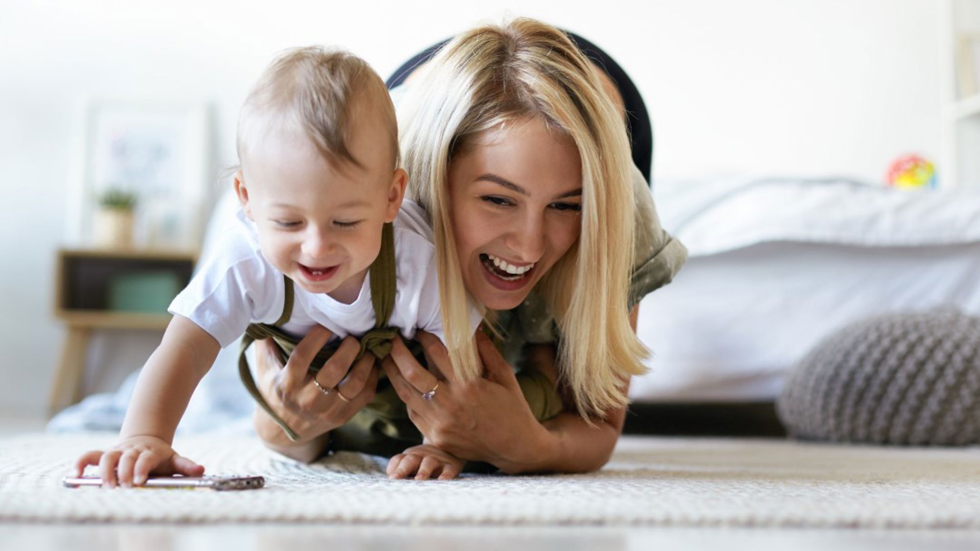Mother playing with her baby, at GMHBA we know the importance of balance and family