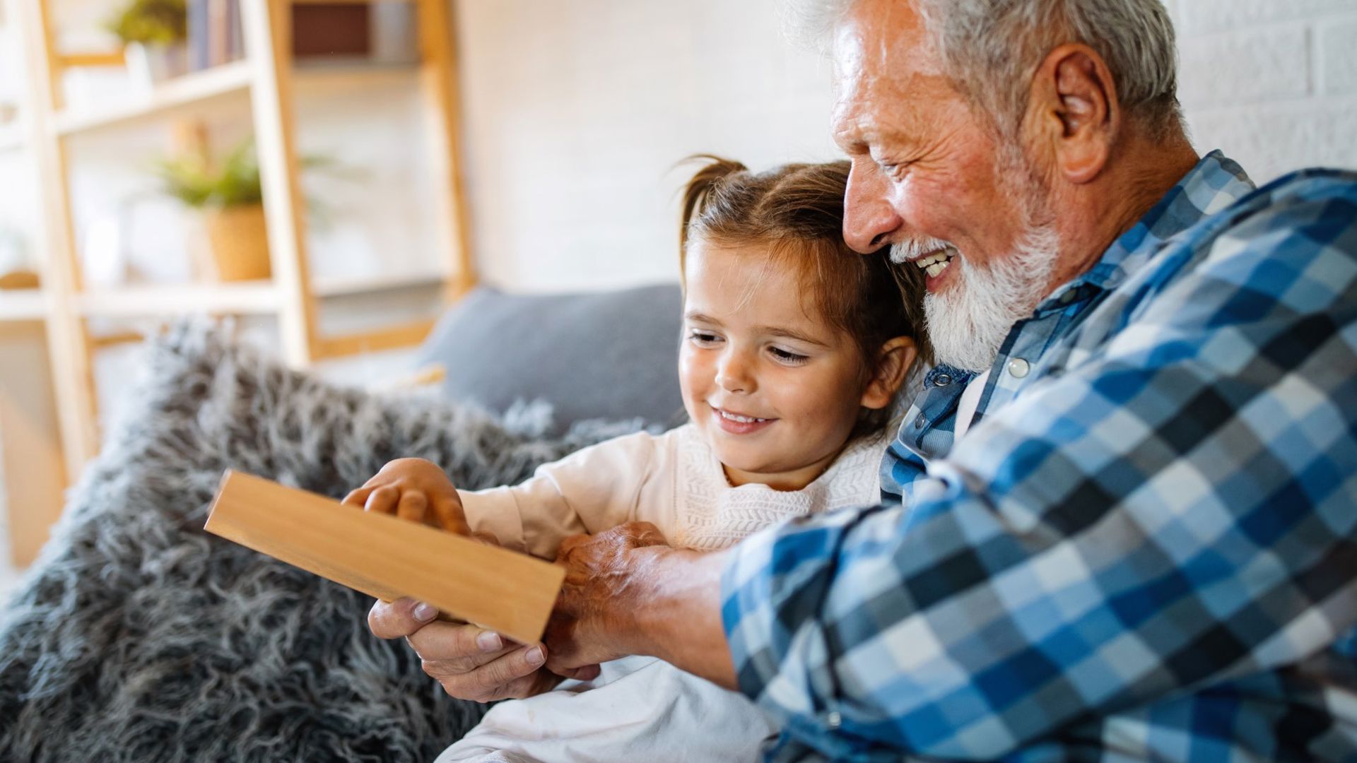 GMHBA member with their granddaughter checking their extras annual limits in the GMHBA member area