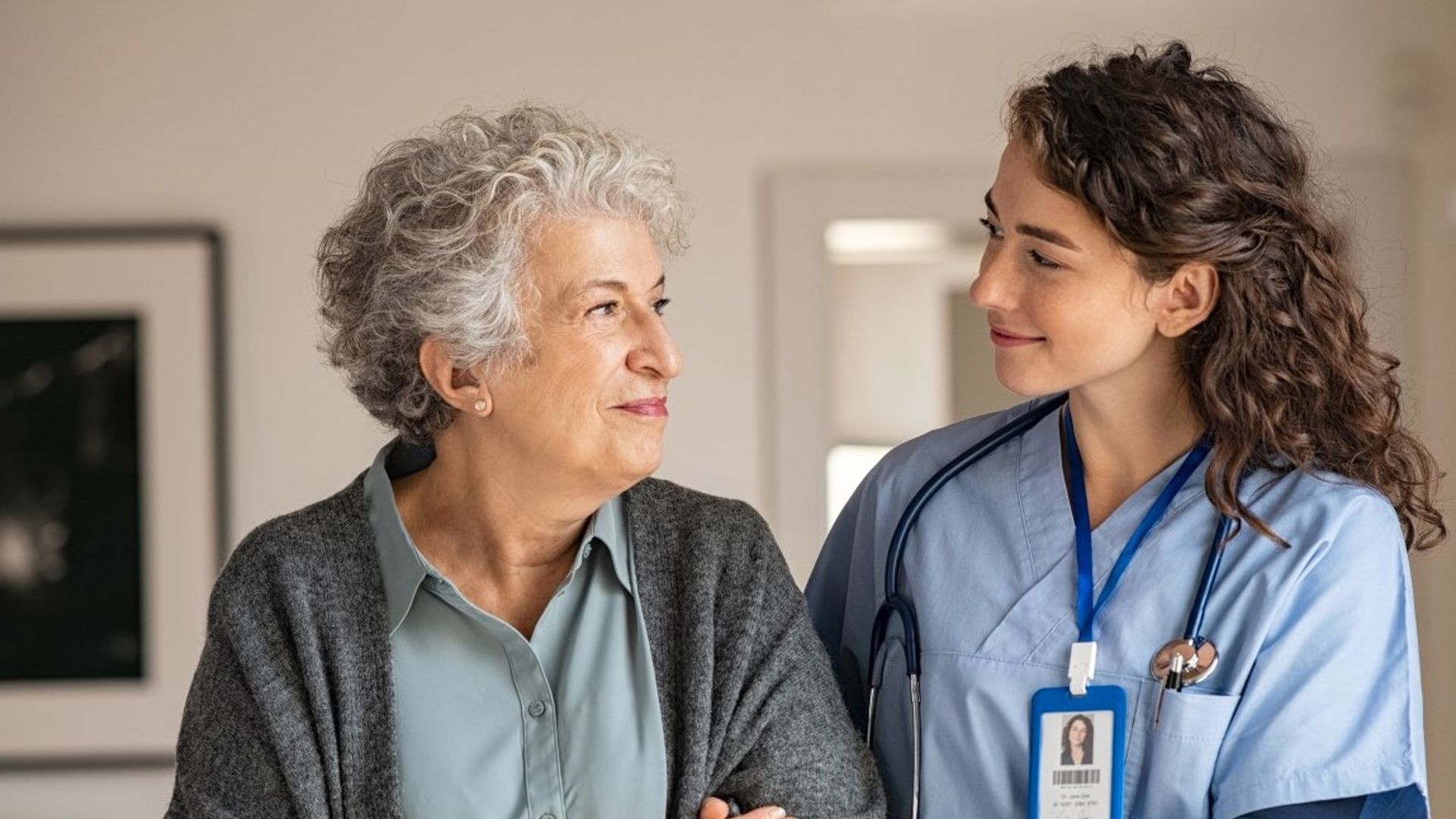 GMHBA member walking down corridor with nurse in hospital