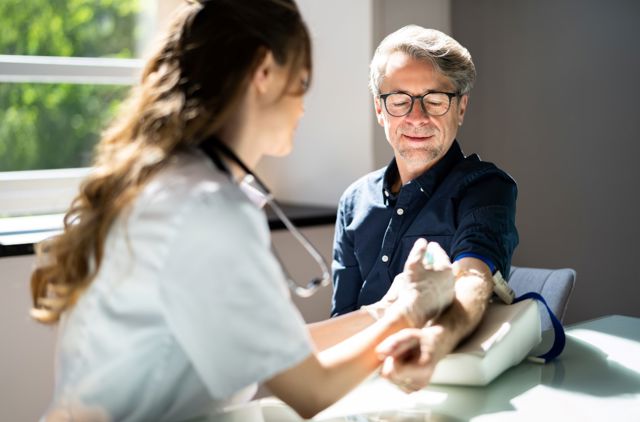 Man getting blood draw at a GMHBA medical clinic