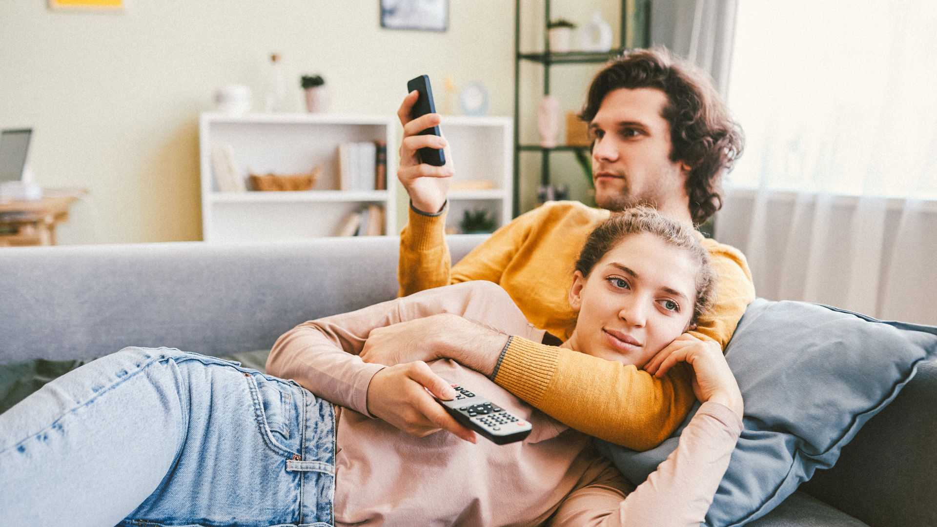 Young couple on the couch enjoying peace of mind