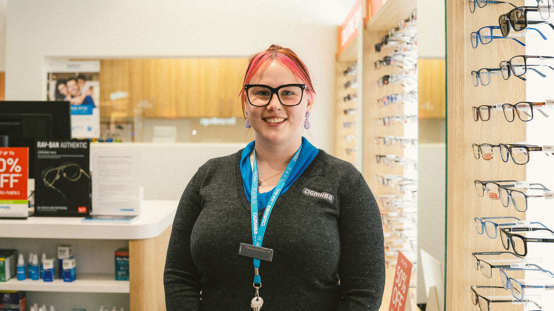 GMHBA Eye Care Geelong retailer worker standing in front of store