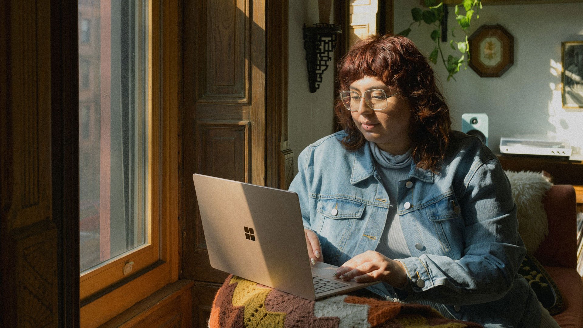 Young Woman on Laptop reviewing cover
