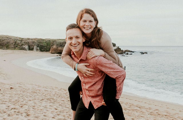 Young couple smiling on the beach 