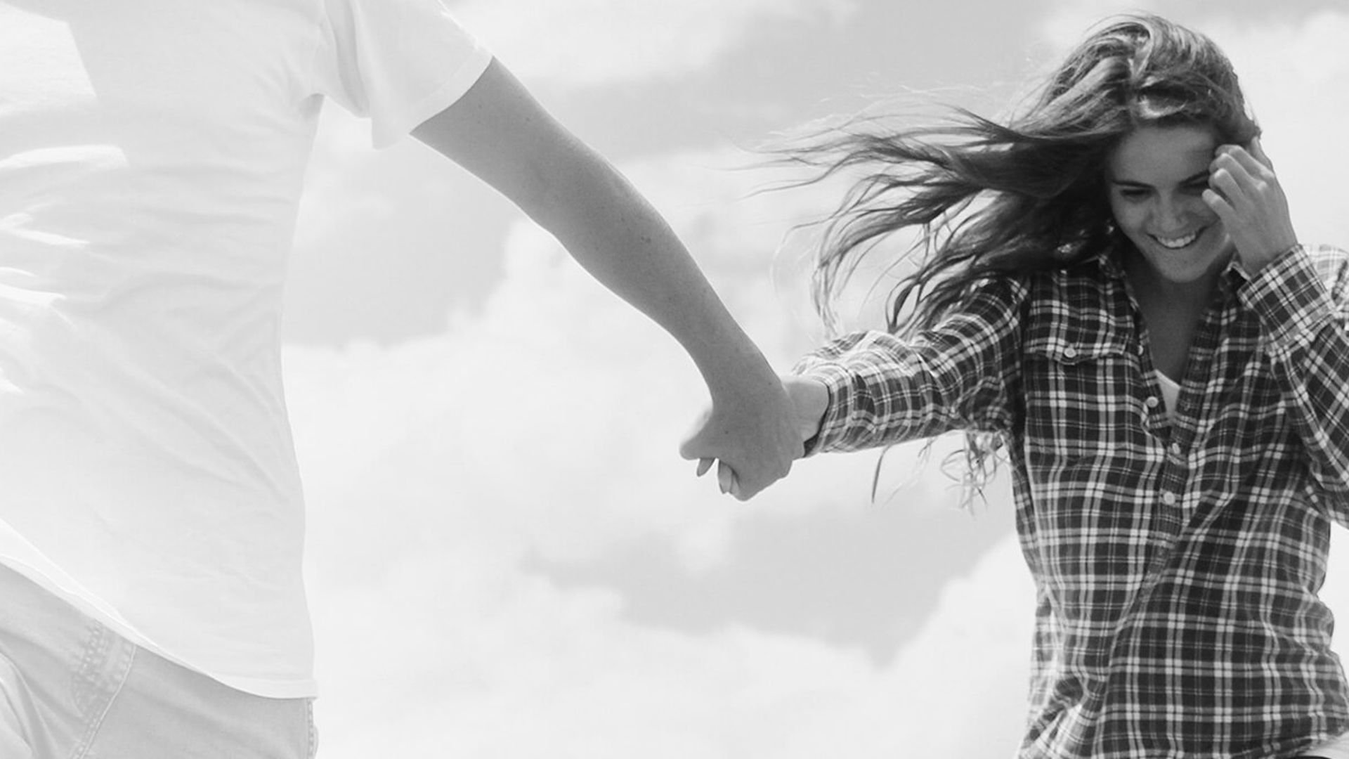 WOman playing around with partner in the wind