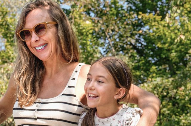 Mum and daughter enjoying time together outdoors during spring