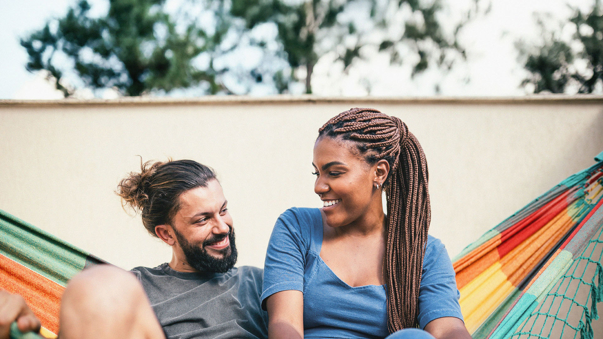 Young GMHBA couple relaxing in a hammock