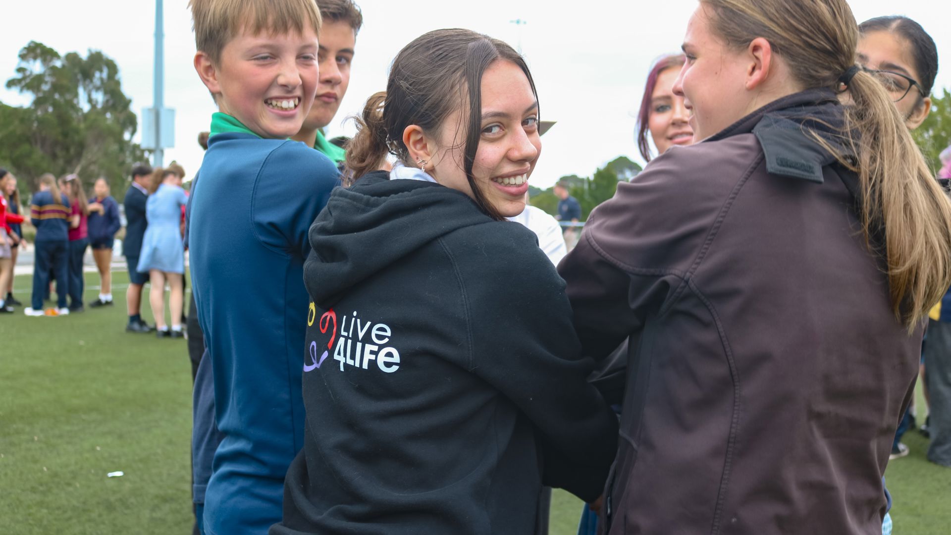 Students smiling with Live4Life